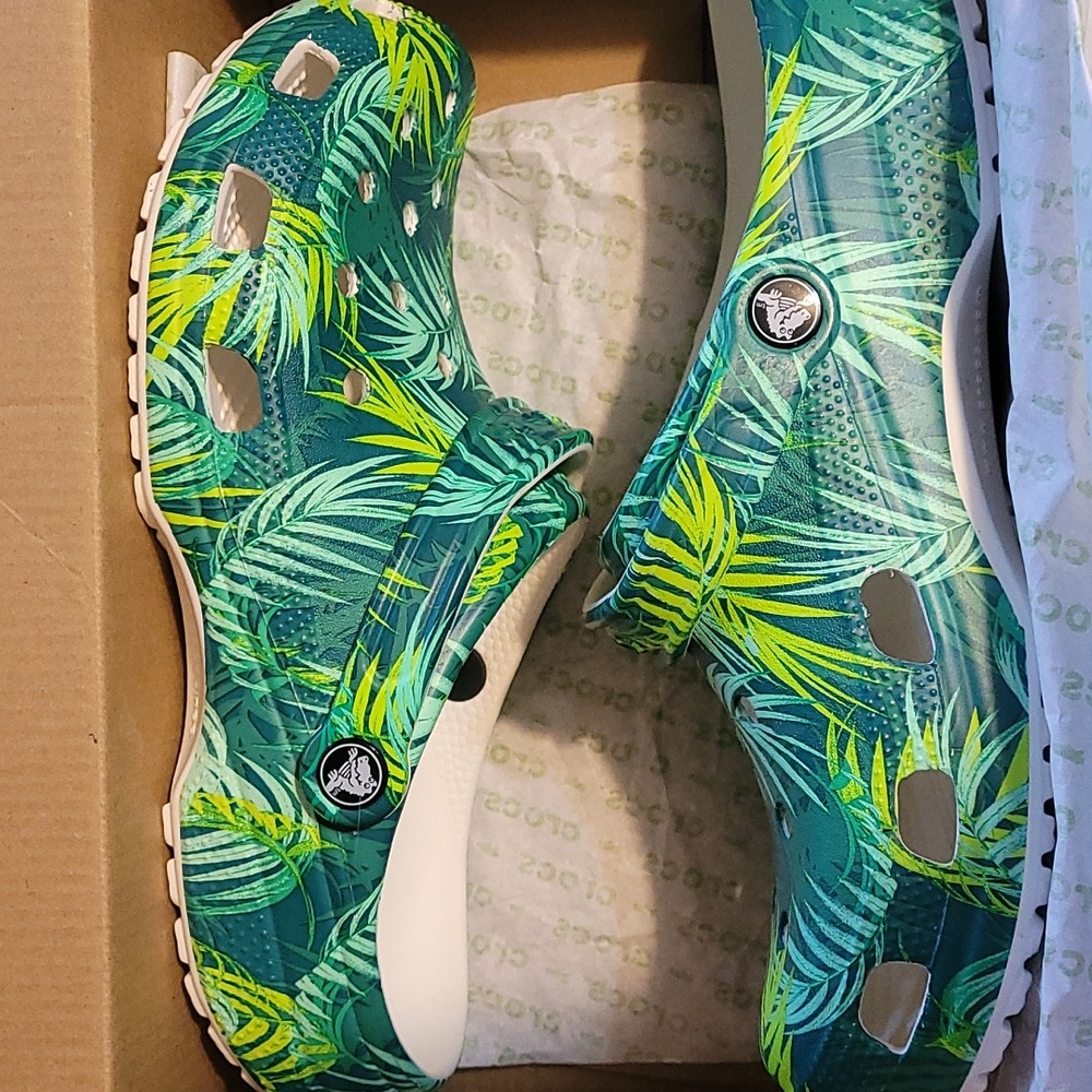Women's 11/ men's 9 tropical Crocs
